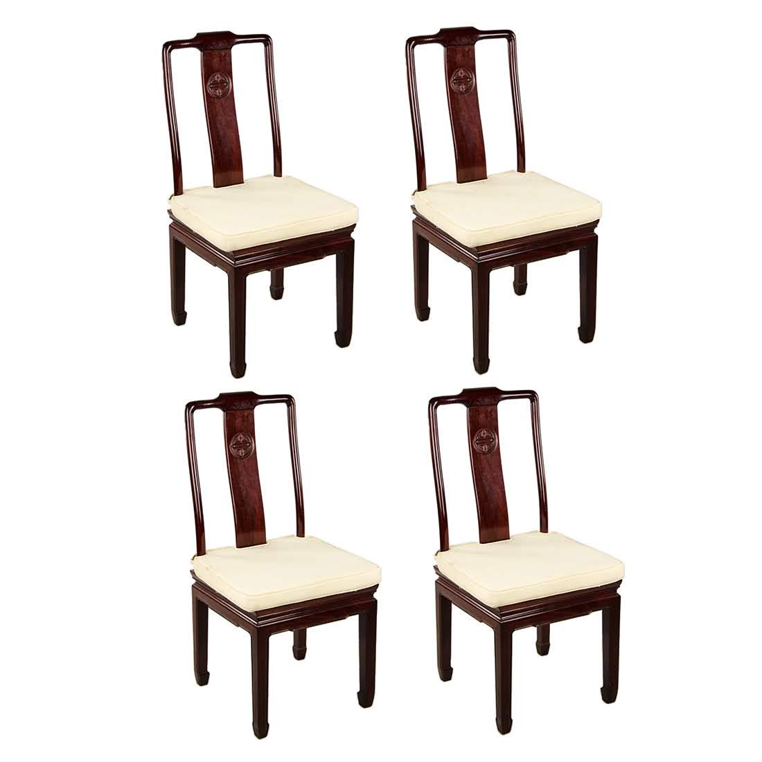 Set of Four Chinese Ming Style Rosewood Dining Chairs: A set of four vintage Chinese Ming style rosewood dining chairs. Each chair features a simple rectangular backrest decorated with a carved medallion on the center of the splat. Each rests on four squa