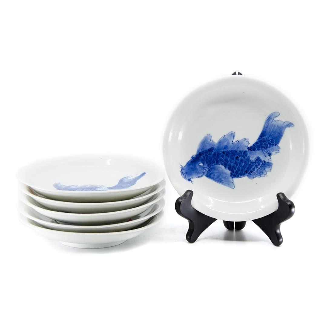 Set of Six Chinese Blue and White Porcelain Koi Fish: A set of six vintage Chinese blue and white porcelain bowls. Each bowl features a hand-painted blue koi fish design on the front over a white base. They are unmarked. Dimensions: 6.5" (diameter) Flat 