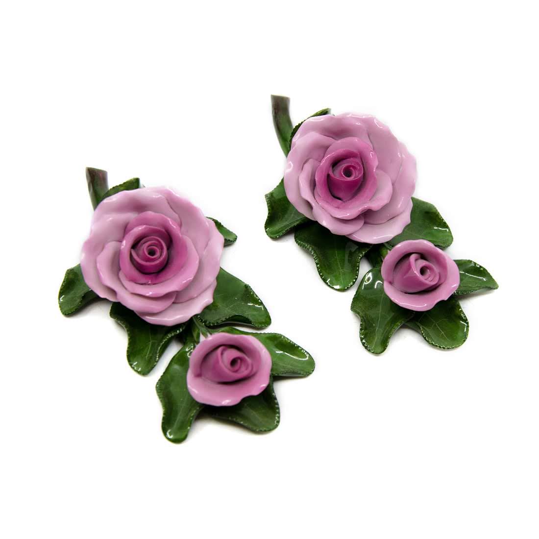 Herend Hungary Porcelain Roses on Leaf Figurines - 9112: A pair of Herend Hungary porcelain roses on leaf figurines. The flowers are hand-painted pink with green leaves. Both pieces are marked with Herend's maker's mark and numbered "9112" on the underside.