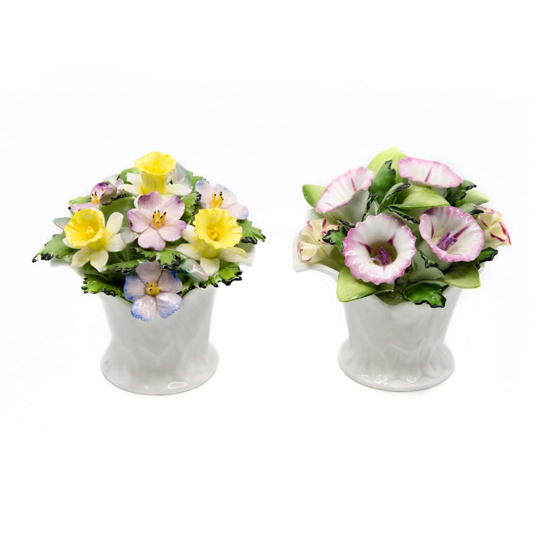 Pair of Royal Doulton Bone China Floral Bouquets: A pair of vintage Royal Doulton bone china floral bouquets. Each piece is hand-painted in a multi-colored palette and marked with Royal Doulton's maker's mark on the underside. Dimensions: 3.75"H x 4"