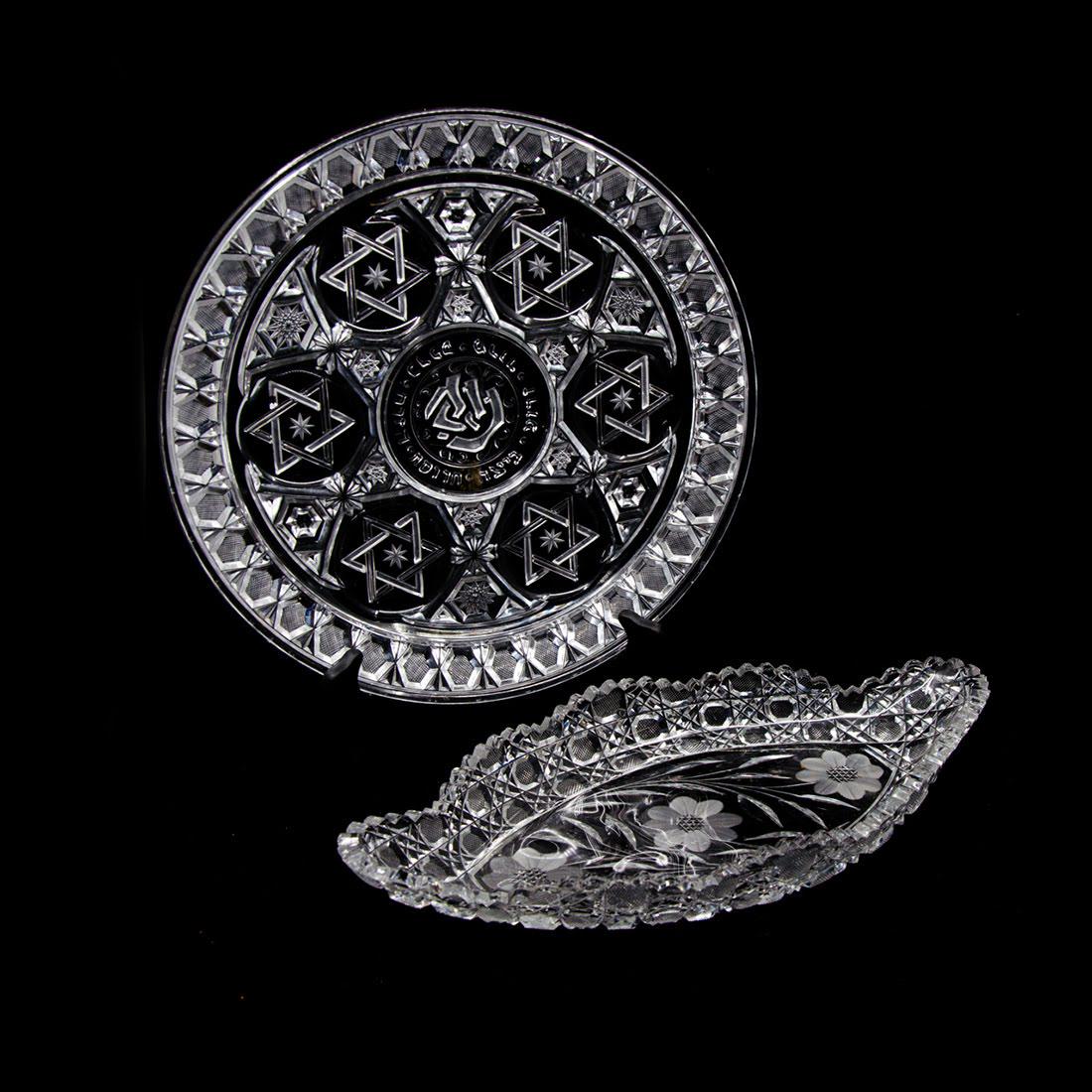 Grouping of Cut Crystal Serveware: A grouping of two vintage cut crystal serveware pieces. This lot includes a round Star of David motif platter and a floral motif tray. They are unmarked. Dimensions: 12.5"W x 12.5"D (for platter); 2"H