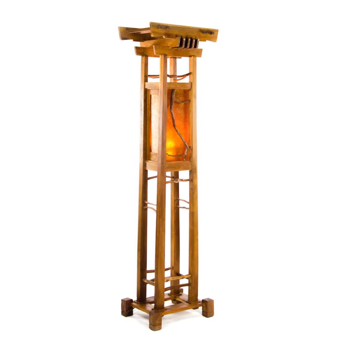 Arts & Crafts Mica Wooden Totem Floor Lamp: An Arts & Crafts mica wooden totem floor lamp. This piece features a wooden frame with a paneled mica section in the center, which holds a single light. The frame is decorated with tree branch appliqu