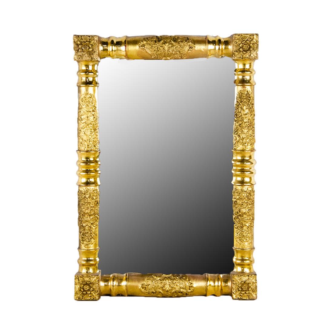 Antique Carved Giltwood Mirror: An antique mirror. This piece features a columnar style giltwood frame decorated with ornate foliate carvings in each section. It is unmarked and equipped with a wire on the verso for hanging. Conditi