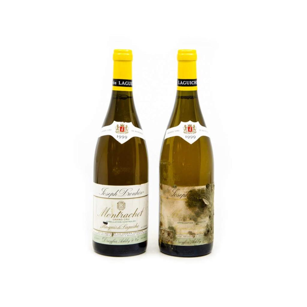Joseph Drouhin Marquis de Laguiche Montrachet Grand Cru: 2 unopened 750ml bottles of Joseph Drouhin Montrachet Grand Cru 1999. From a single owner collection, removed from a temperature and humidity controlled wine cellar. Labels have mold and small tears.