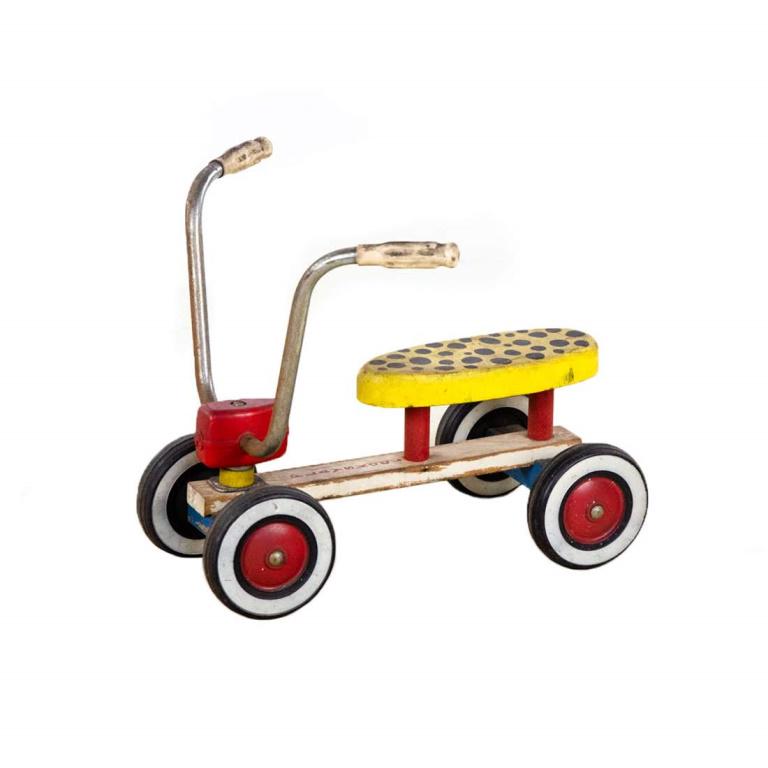 1960's Lightning Bolt 4 Wheel Scooter by Playskool: 1960's Lightning Bolt 4 Wheel Scooter by Playskool having banana style bicycle seat and handlebars on a wooden chassis. Overall it is in good condition showing signs of normal use.