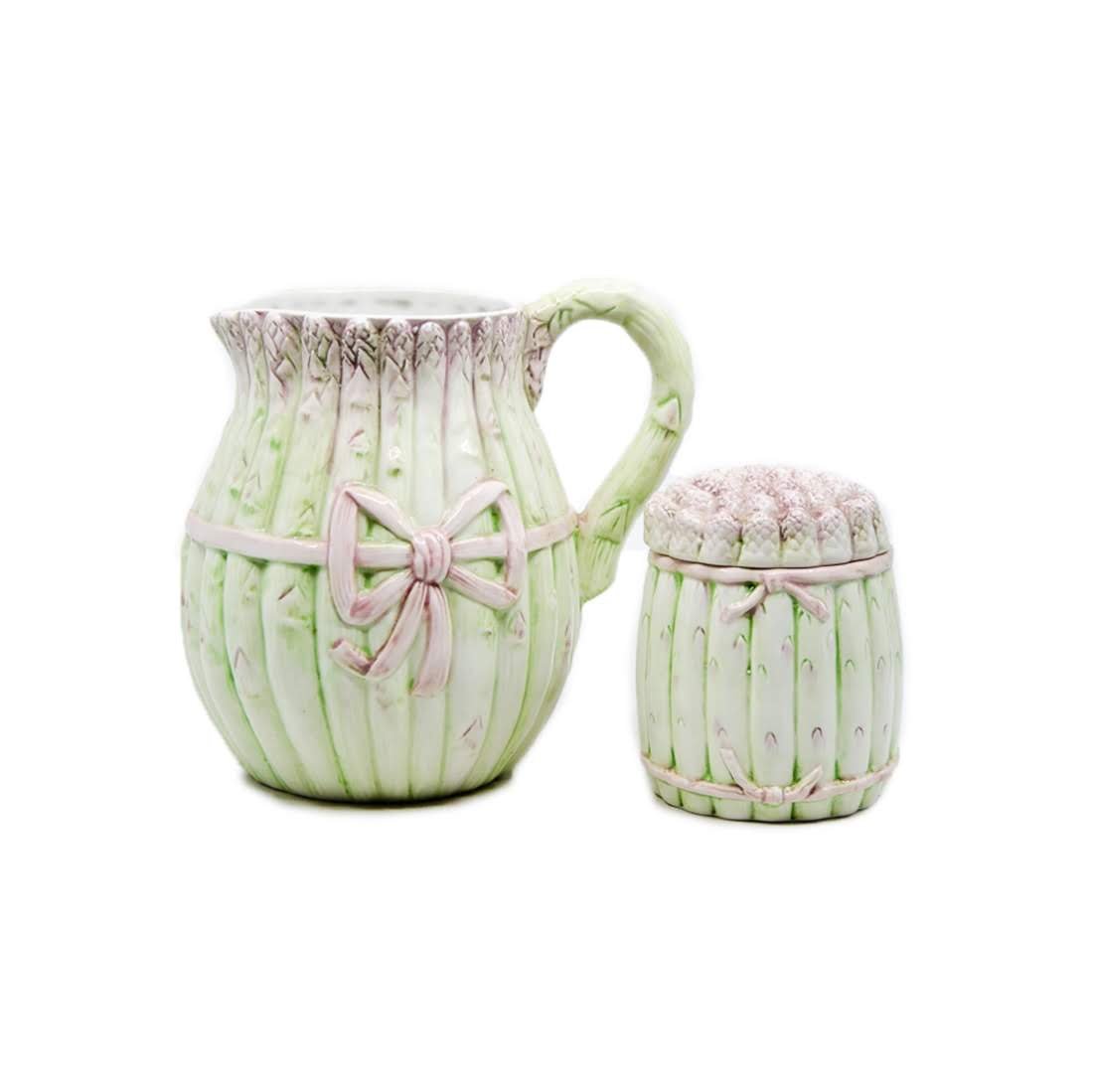 Italian Asparagus Porcelain Pitcher and Lidded Jar: Italian asparagus painted ironstone porcelain pitcher and lidded storage jar. Made in Italy. Stamped '209' and '4973' one jar, and '209' on pitcher. The pitcher measures 7.5" tall and the jar measures