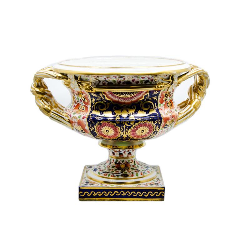 Old Paris Gilded Gold and Blue Painted Urn: 19th Century Old Paris gilded gold and blue urn with handles.