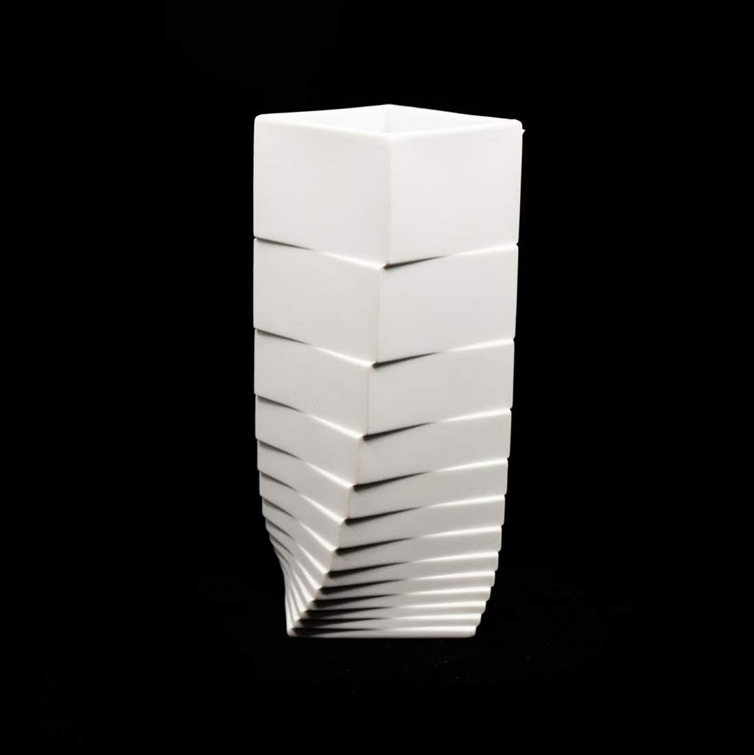 Rosenthal Studio Line Twisted Turnus Vase: Rosenthal Studio Line Twisted Turnus white matte vase featuring a twisted square tiered design by Christa HÃ¤usler-Goltz. There is a makers mark with the artists name and signature on the bottom.