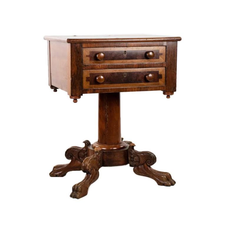 William IV 2 Drawer Rosewood Work Table: William IV double drawer rosewood work table. Face of drawers contain satinwood veneer and brass skeleton key holes. Turned knob handles and supported by pedestal base with lions foot and acanthus scr