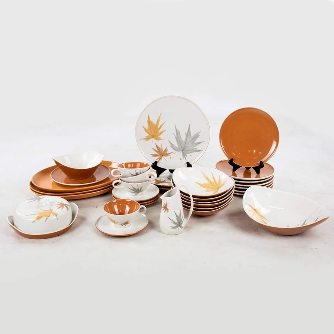 MCM 33 Piece Iroquois Informal True China by Ben Seibel: Mid Century Modern thirty-three piece Iroquois Informal True China set by Ben Seibel. Two sets combined as one featuring an ivory with maple leaf design with a solid ivory and mocha set.