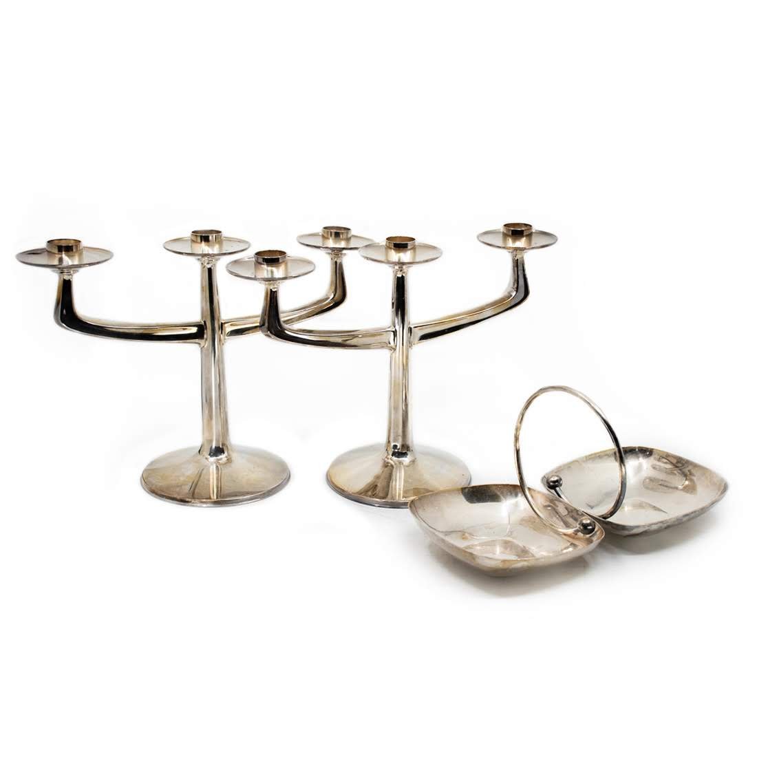 Group of 3 Silver Plated Bruckmann Candelabra Set: Group of three silver plated candelabra set by Bruckmann and candy dish by Fisher. Set includes: two candelabras, and one candy/sauce dish. Candelabras measure 8.5" x 11.5". Bruckman Silber Auflage (s