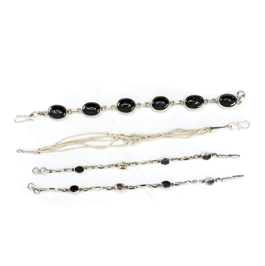 Group of Four Cut Stone Silver Tennis Bracelets (1 of 3)