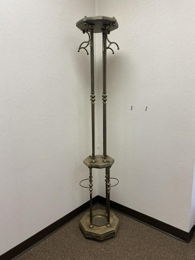 Metal Hat/Coat Rack: An vintage metal and wood hat/coat rack with four hooks at the top and an opening near the bottom for umbrellas.