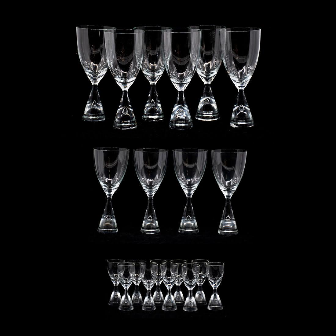 Set of 20 Holmegaard Princess Glasses: A set of 20 Holmegaard Princess tulip form glasses including 6 wine glasses and 4 water glasses and 10 cordial glasses. The larger glasses are all etched signed on the bottoms. Designed by Bent Severi