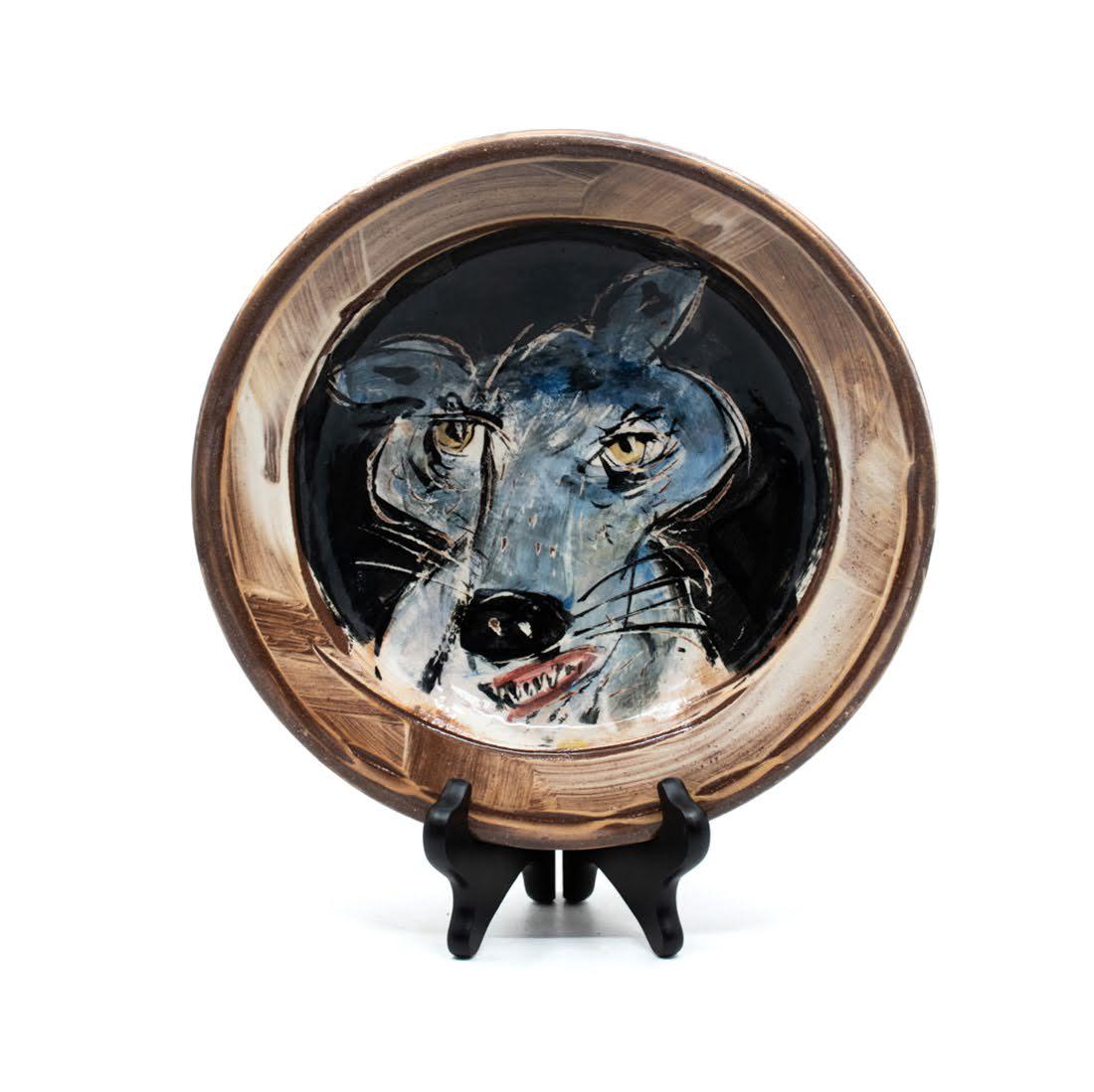 Ron Meyers Pictorial Ceramic Hand Thrown Wolf Plate: A hand thrown painted pictorial art pottery plate depicting a cartoon stylized wolf by artist Ron Meyers. Dimensions: 2"x 10"DIA. Ron Meyers has been in clay for over 30 years, known for his loose, wh