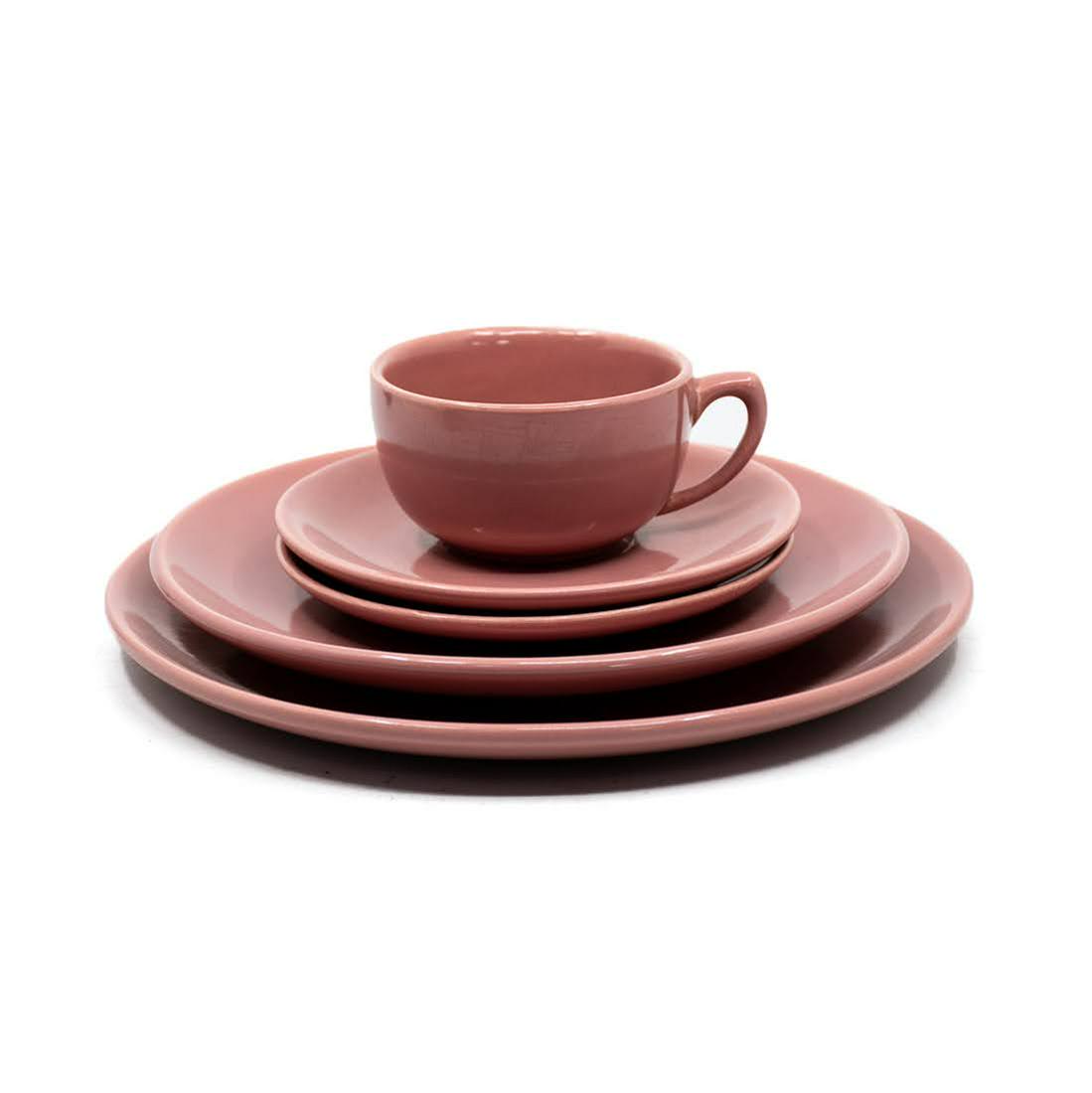 Bauer Pottery Monterey Moderne Pink Plates Setting of 5: A set of five Bauer Monterey Moderne pottery pink plates including one teacup, two butter plates, one salad plate, and one dinner plate. They are marked on the underside.