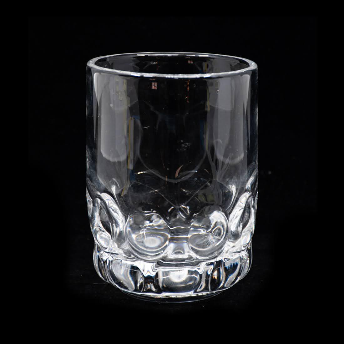 Orrefors Sweden Mouth Blown Pressed Glass Vase: Orrefors Sweden mouth blown pressed glass vase with heavy circular indentations. Etched signed on the bottom and numbered. In good condition. Measures 5.5" x 4" x 4"