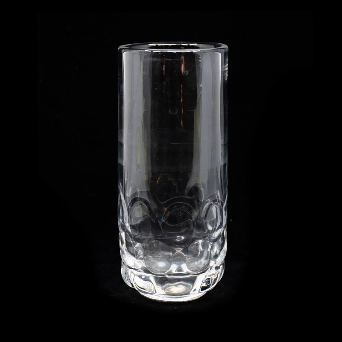 Orrefors Sweden Mouth Blown Pressed Glass Vase: Orrefors Sweden mouth blown pressed glass vase with heavy circular indentations. Etched signed on the bottom and numbered. In good condition. Measures 9" x 4" x 4"