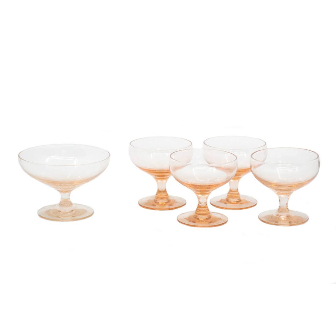 Set 5 Tourmaline Morganton Glasses by Russel Wright: Set of five Morganton tourmaline tinted coupe champagne glasses designed by Russel Wright. Glass appearing on far left of the image is slightly larger than the four on the right side of the image. Fou