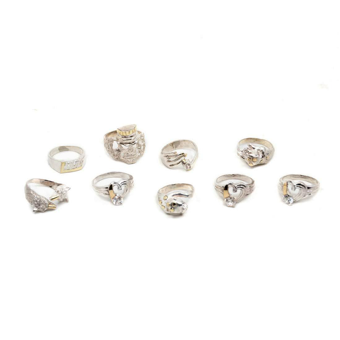 Group of 9 Sterling Silver Rings from Ecuador: A group of nine sterling silver .925 gemstone rings with skeleton, wolf, and lion motifs.