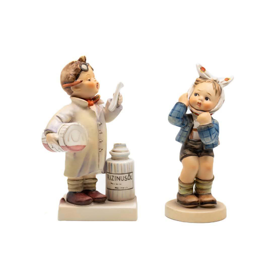G Hummel Little Pharmacist 322 and Boy With Toothache: Goebel Hummel #322 Little Pharmacist TMK 4 figure, featuring a young boy dressed as a pharmacist with a script in his hands and #217 Boy With Toothache TMK 3 figure, featuring a boy holding his jaw fr