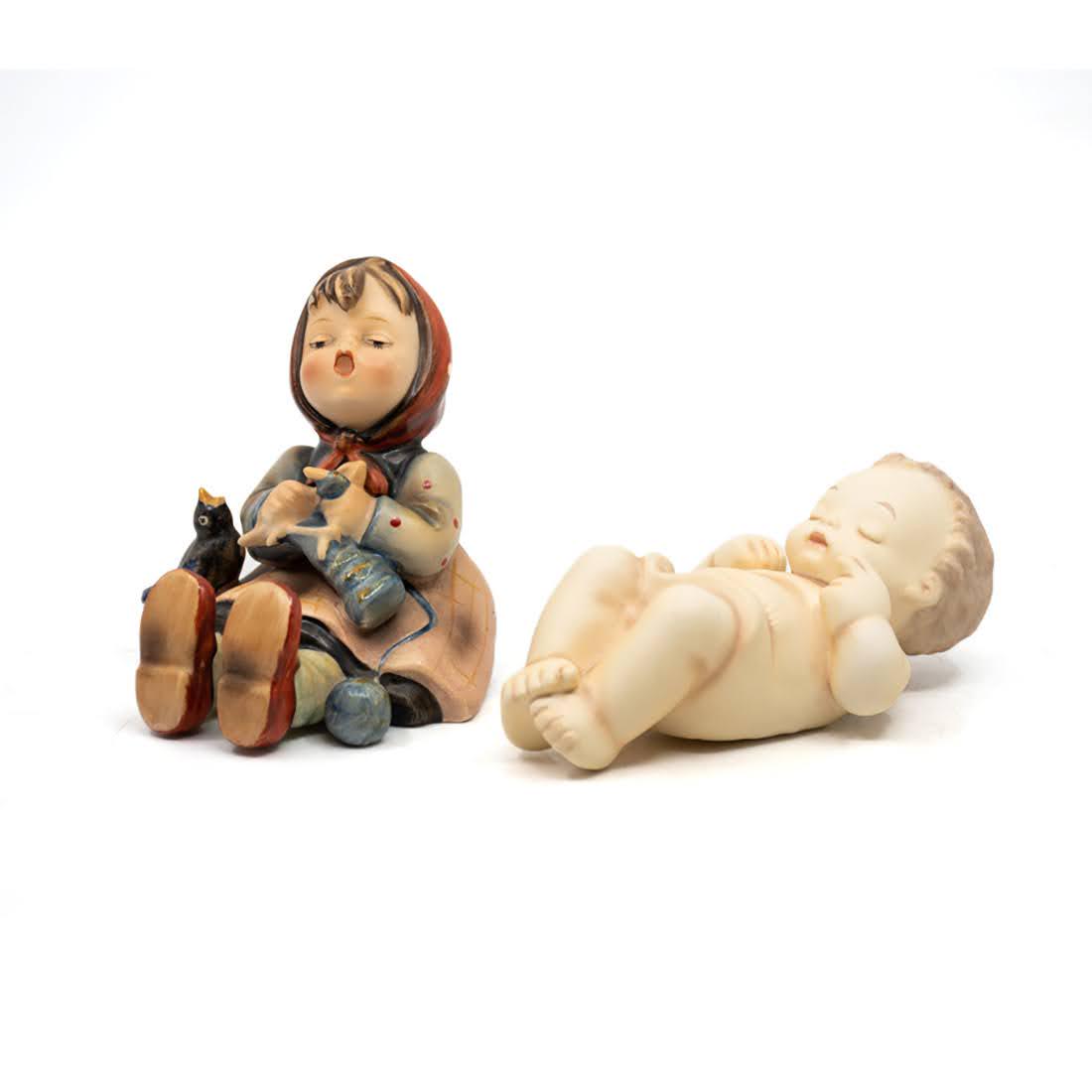 Goebel Hummel Happy Pastime 69 and Blessed Child: Goebel Hummel #69 Happy Pastime TMK 1 figure, featuring a girl knitting with a bird on her lap and #78/II/1/2 Blessed Child TMK 7 figure, featuring an infant swaddled in cloth.