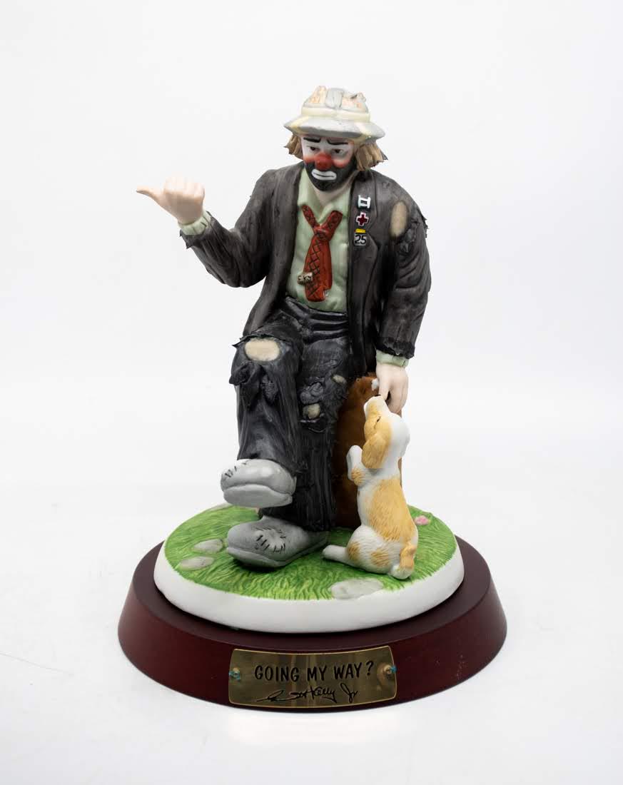 Emmett Kelly Jr "Going My Way" Clown: An Emmett Kelly Jr "Going My Way" Clown figure, featuring a clown hitchhiking with his dog. It is marked on the underside No. 0599.
