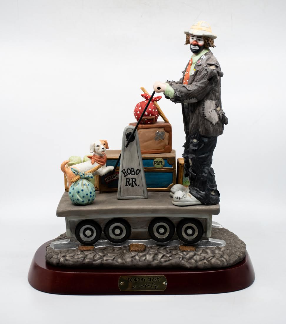 Emmett Kelly Jr "Economy Class" Clown: An Emmett Kelly Jr "Economy Class" Clown figure, featuring a clown pumping a train cart with his dog and their luggage. It is marked on the underside 0891/1500.