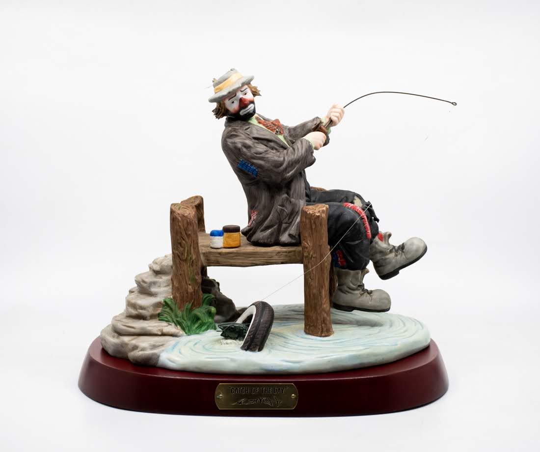 Emmett Kelly Jr "Gone Fishing" Clown: An Emmett Kelly Jr "Gone Fishing" Clown figure, featuring a clown fishing but catching a boot by accident. It is marked on the underside 0891/5000.