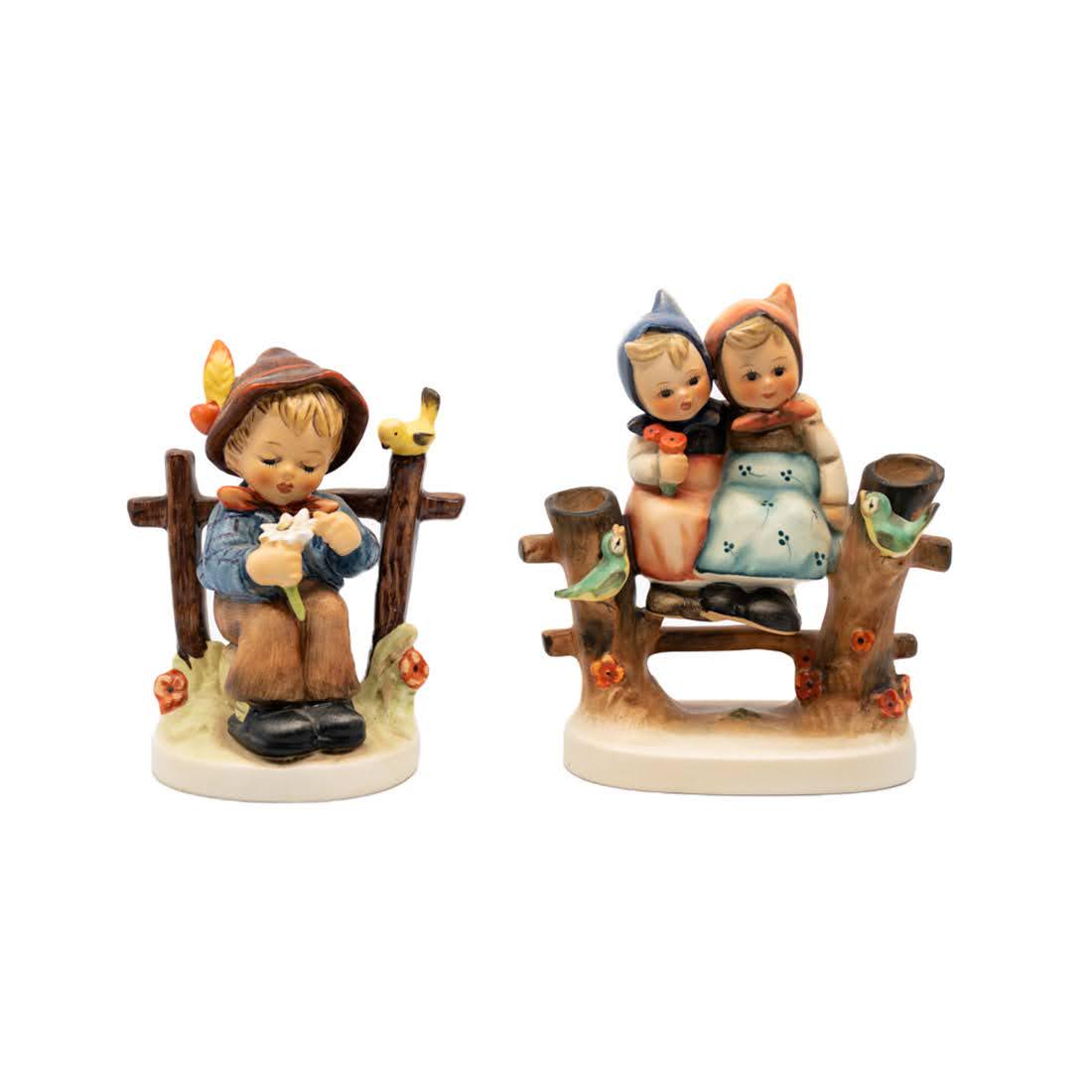 G. Hummel She Loves Me She Loves Me Not 174 and: Goebel Hummel #174 She Loves Me, She Loves Me Not TMK 6 figure, featuring a young boy sitting against a fence picking petals off of a flower and #179 Coquettes TMK 3 figure, featuring two young girls