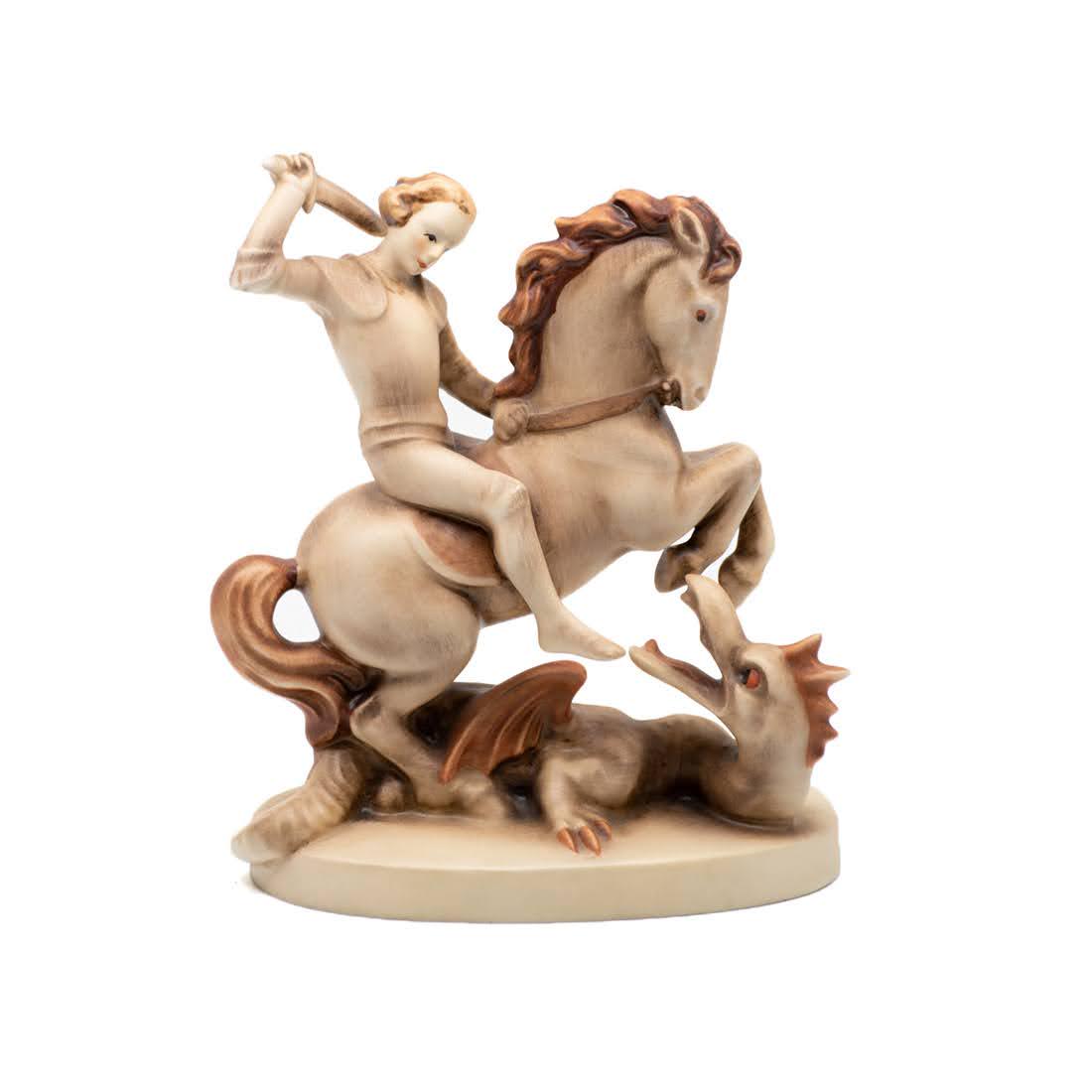 M.I. Goebel Hummel St. George 55 Figurine: M.I. Goebel Hummel #55 St. George TMK 3 figure, featuring St. George on horseback weilding a sword and fighting a dragon.