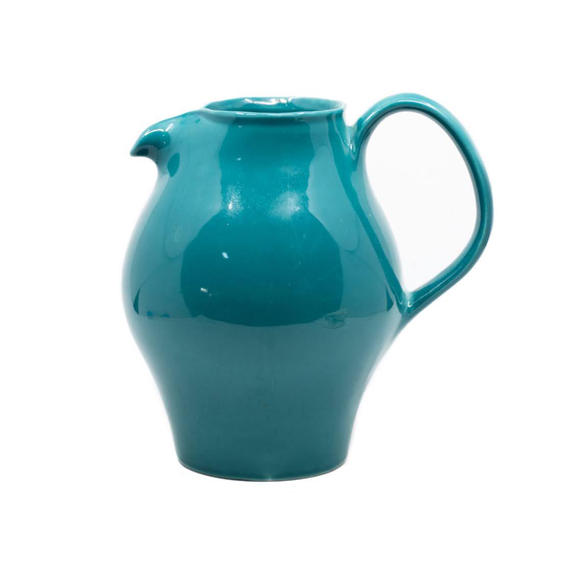 Russel Wright by Iroquois Casual Turquoise Pitcher: A Russel Wright by Iroquois Casual Turquoise pitcher having bulbous body and round top. Pattern discontinued. Marked on underside. Measures 8.5 x 9.5 x 6.5.