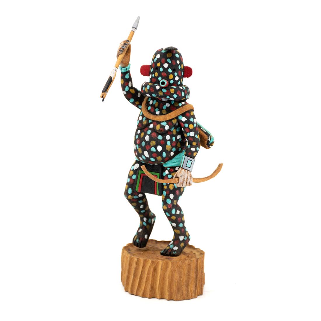 Native American Hopi Firewalker Germinator Katsina Doll: A Native American Hopi Indian carved Firewalker Germinator Katsina by Edwin Choyon Jr. The figure is believed to originated in Zuni Pueblo having a blackened appearance with vibrantly colored spots. H