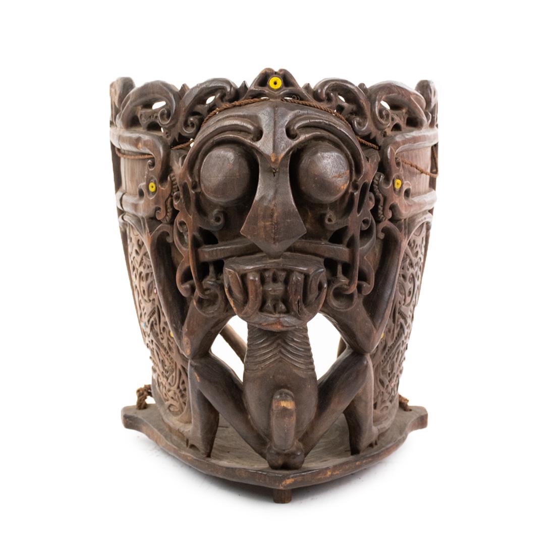 Indonesia Borneo Bahau-Busang Hawat or Baby Carrier: Indonesia Borneo Dayak Aristocratic Bahau-Busang hawat or baby carrier (19th Century), deeply carved wood and fiber back carrying straps, having carved central motif of an "Aso" a type of anthropomorp