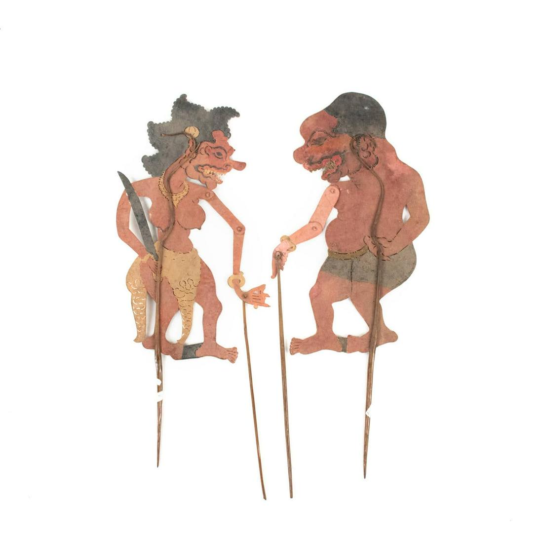 Two Indonesian Wayang Kulit Jurumeyi & Jurumeya Puppets: A set of two Indonesian Wayang Kulit flat puppets (20th century) intricately hand painted on leather hide representing characters Jurumeyi (left) and Jurumeya (right) both from the Kebuman regency of