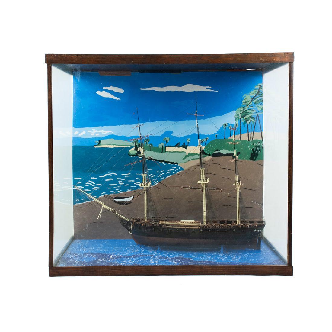 Wooden "Frigate" Model Ship in Glass Case: A wooden Frigate model ship housed in glass and wood frame case with painted background.
