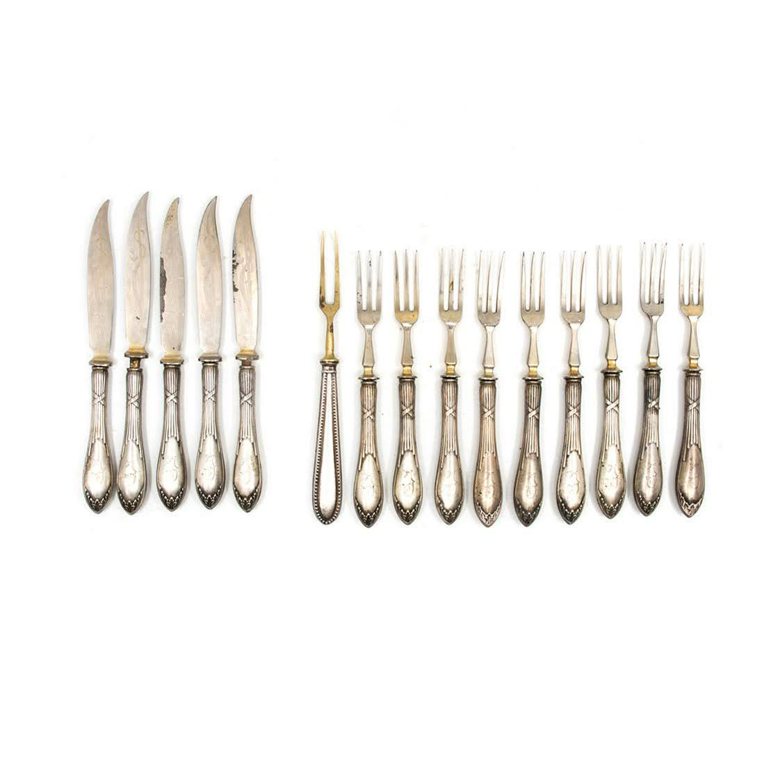 Set of 15 800 Silver Flatware Forks and Knives: Set of 15 800 silver flatware including 10 forks and 5 knives Monogrammed "J" one of the small three prong forks has a different head that is made of brass. Each knife blade has an etched grass motif.