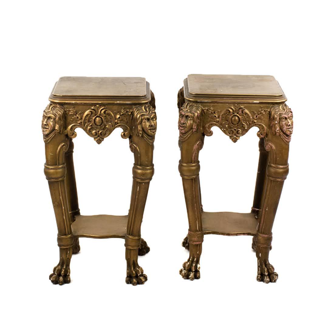 Gold Painted Continental Figural Pedestal Tables: Gold Painted Continental Figural Pedestal Tables painted gold wood and composite with faces on each corner, lower shelf, and lion paw feet.