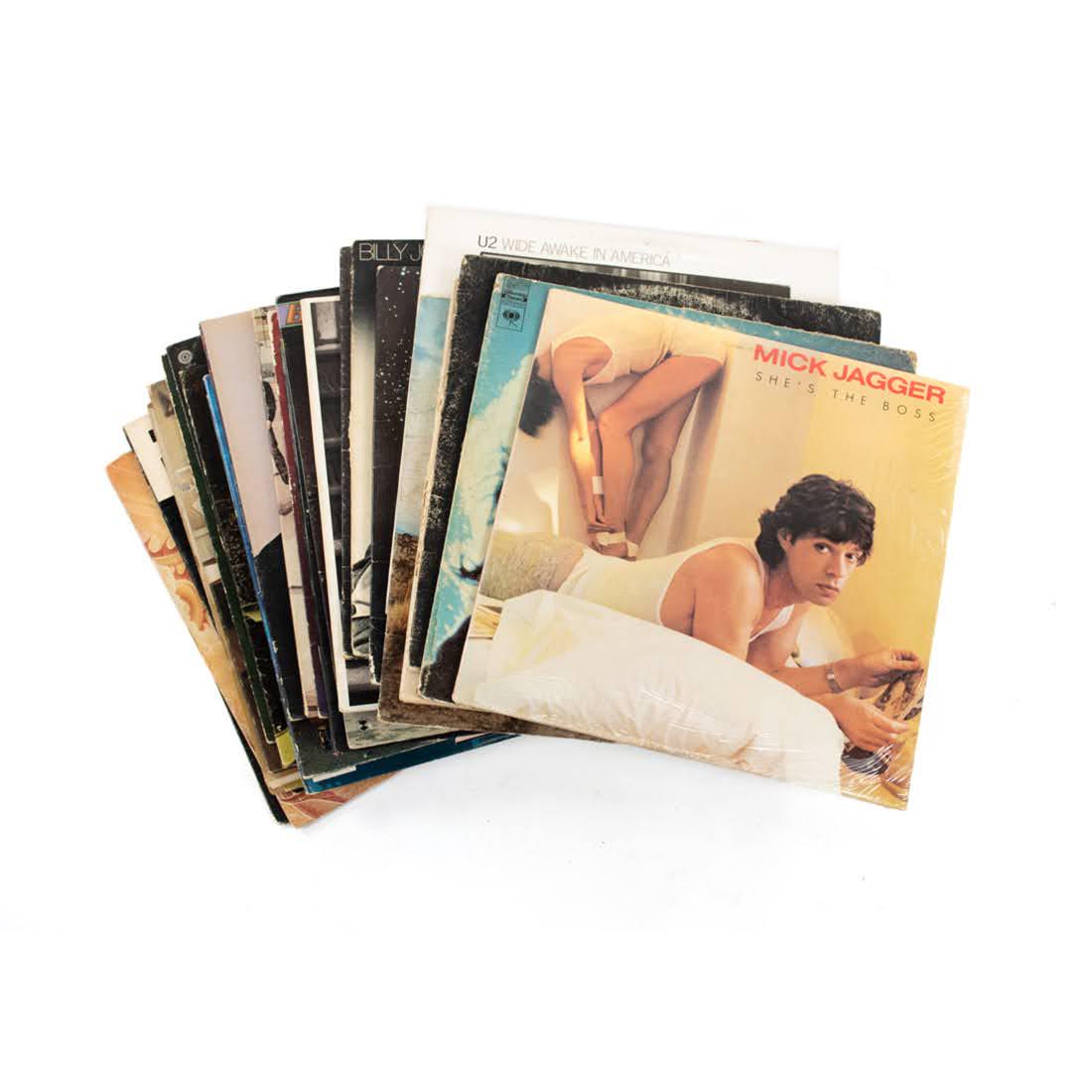 Group of Rock and Roll Vinyl Albums: Mick Jagger "She's The Boss" , Bob Dylan's "Greatest Hits", Crosby Stills, and Nash "CSN", 1977, Cat Stevens "Foreigner 1973, Barbra Streisand "Stoney End", U2 "Wide Awake in America" 1984, Rush "2112