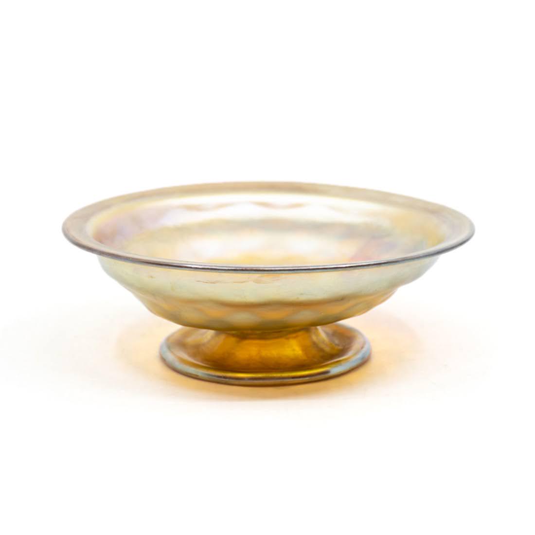 Louis Comfort Tiffany Favrile Iridescent Footed Compote: A Louis Comfort Tiffany Studios Favrile footed compote dish having iridescent coloring and formed pedestal base. Marked on the underside.