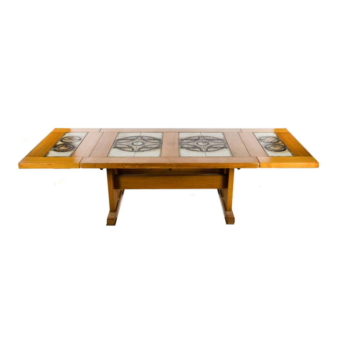 Danish Modern Poul Cadovius Teak Tile Dining Table: A mid-century Danish modern teak dining table by Poul Cadovius having a four-section inlaid tile top. The hand-painted beige tiles are assembled to create black encircled star formations. There is a d