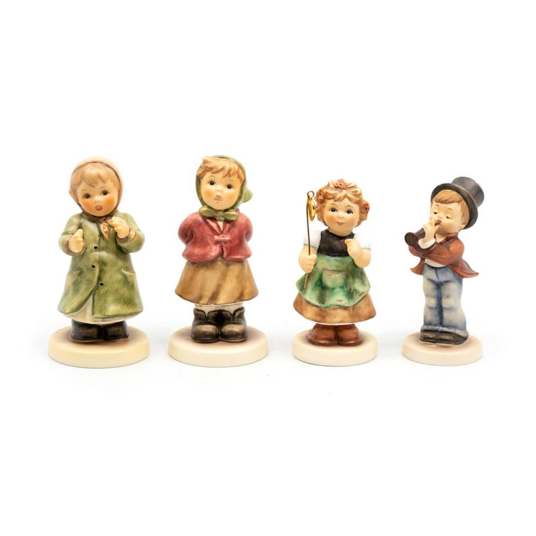 Group of 4 Goebel Hummels including Serenade 85: Goebel Hummel #2183 Keeping Time TMK 8 features a girl clapping, #2181 Clear as a Bell TMK 8 features a girl in a scarf singing, #2298 My Lucky Heart TMK 9 features a girl holding a heart with a pole,