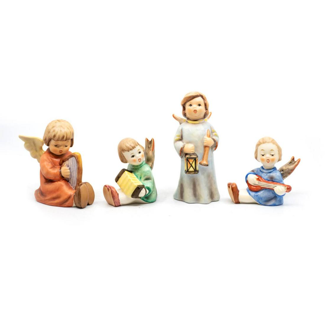 Group of 4 Goebel Hummels including Hosianna 480: Goebel Hummel #454 Song of Praise TMK 6 features an angel singing and playing the harp, #238/B Angel with Accordion" TMK 6 features an angel playing an accordion, #480 Hosianna TMK 6 features an angel