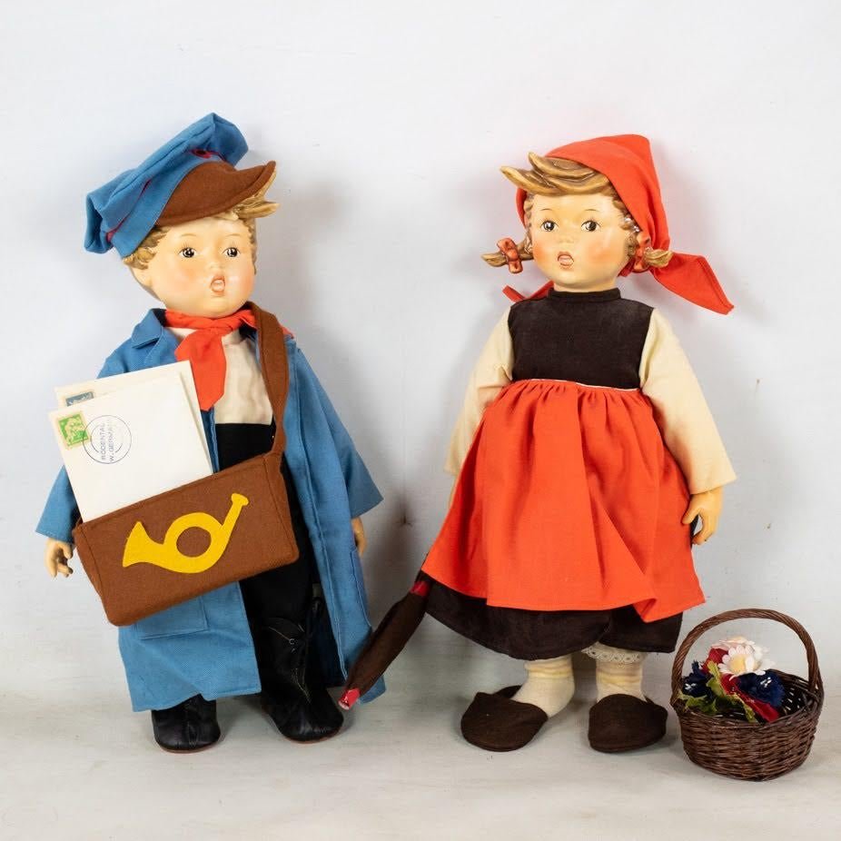 Goebel Hummel On Holiday 716 and Postman 719 Dolls: Goebel Hummel #716 On Holiday Girl doll TMK 4 and #719 Postman Boy doll. They are both wearing fabric clothing with accessories and in the original boxes.