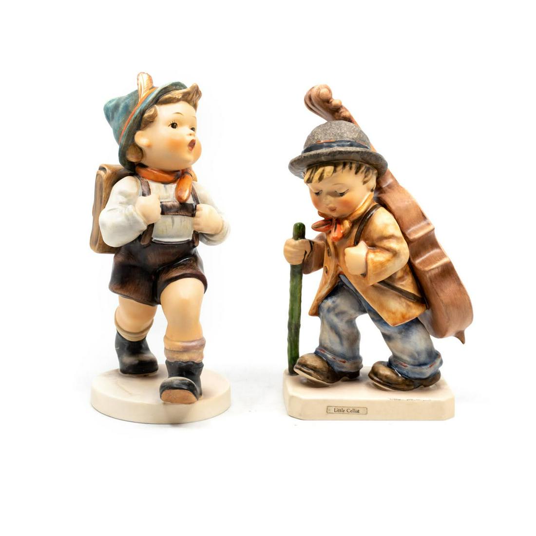 Goebel Hummel School Boy 82 and Little Cellist 89: Goebel Hummel #82/0 School Boy TMK 3 features a by whistling and walking while carrying a backpack, #89/II Little Cellist TMK 6 features a boy walking with a cello strapped to his back.