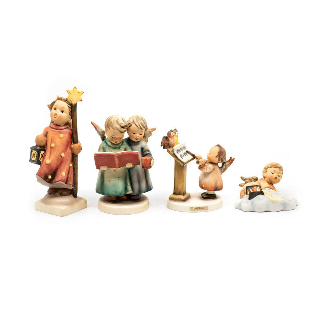 Group of 4 Goebel Hummels including Bird Due 169: Goebel Hummel #343 Christmas Song TMK 6 features a singing angel holding a star topped staff and a lantern, #193 Angel Duet TMK 4 is a candle holder that features two angels, one holding a music book