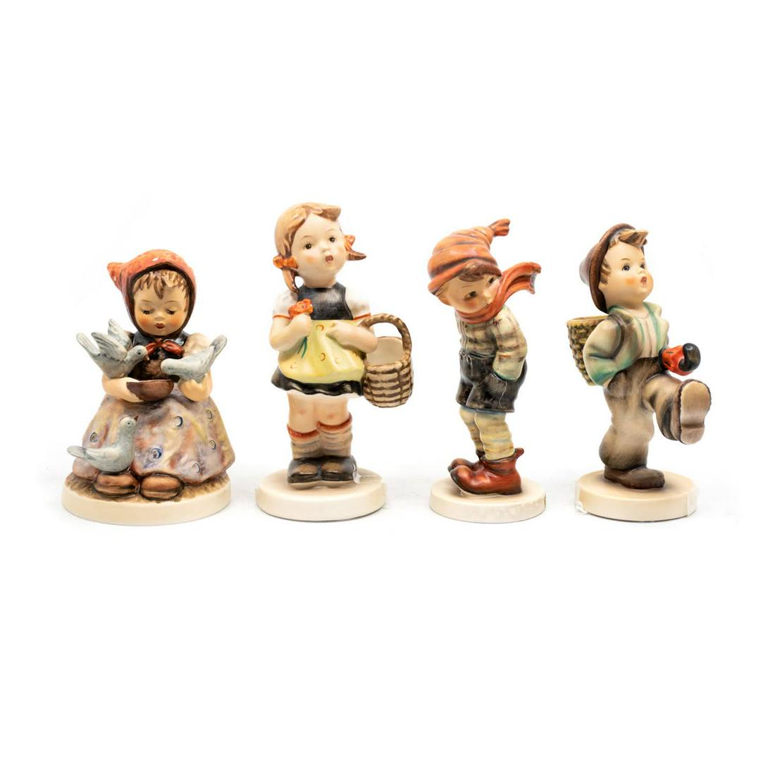 Group of 4 Goebel Hummels including March Winds 43: Goebel Hummel "Cinderella" #337 TMK5 features a young girl feeding two birds from a bowl, "Sister" #98 TMK3, features a young girl with a basket and flowers in hand, "March Winds" #43 TMK3, features a