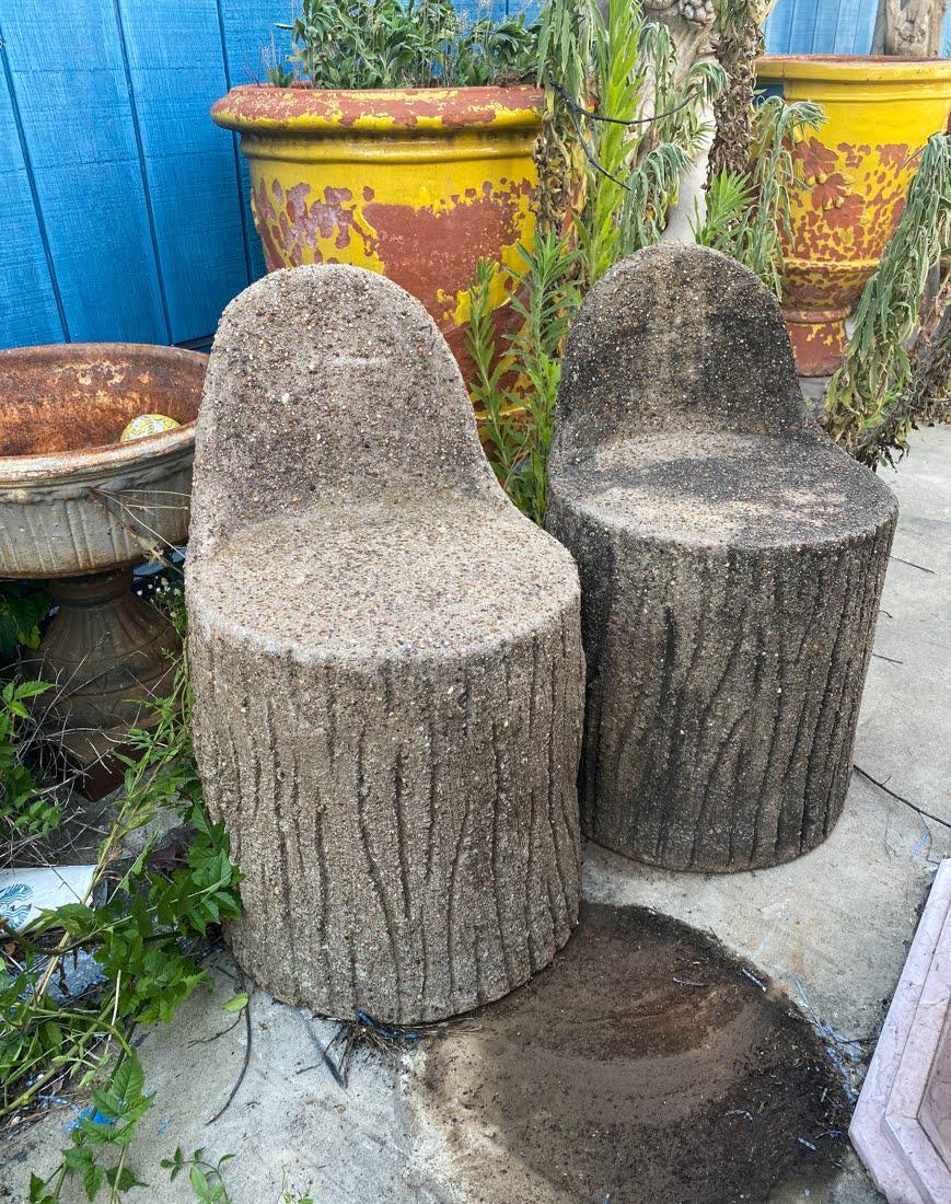 Faux Bois Concrete Tree Stump Form Chairs - a Pair: A pair of faux bois concrete tree stump form side chairs with rounded back rests. They feature carved bark textures throughout. Seat height measures 17".