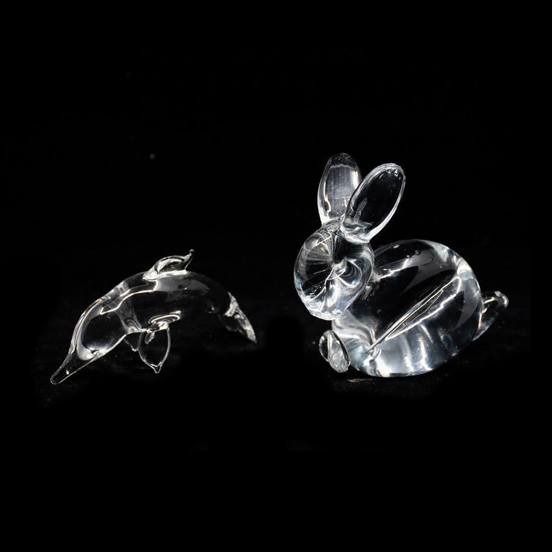 Group of 2 Crystal Rabbit and Dolphin Figurines: A group of two crystal animal figurines including a glass rabbit and dolphin. The rabbit sticker has been lost, the dolphin is marked GF on the underside.
