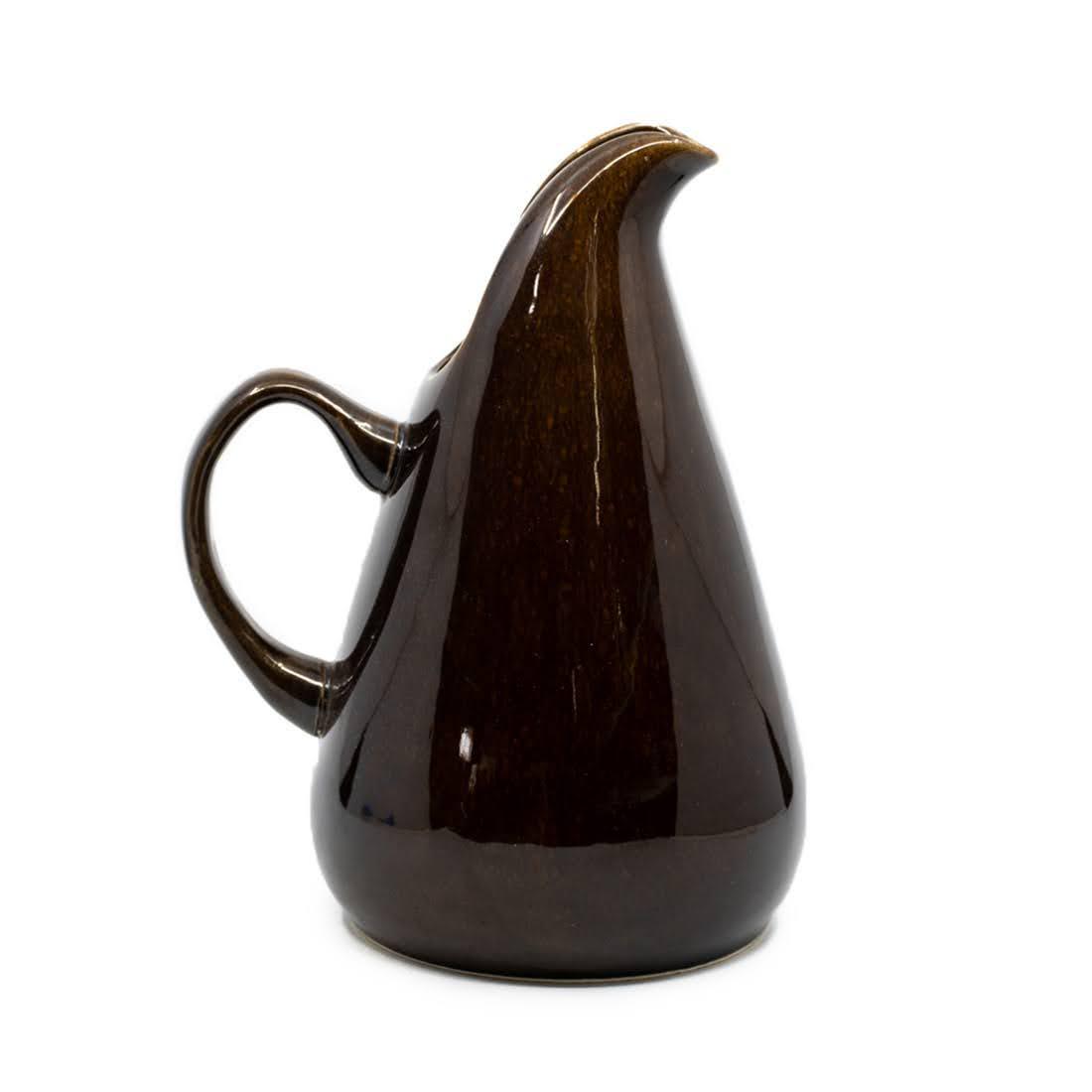 Russel Wright by Steubenville Bean Brown Pitcher: A Russel Wright by Oneida 'bean brown' pattern ceramic pitcher having elongated pour spout and handle. Marked on underside.